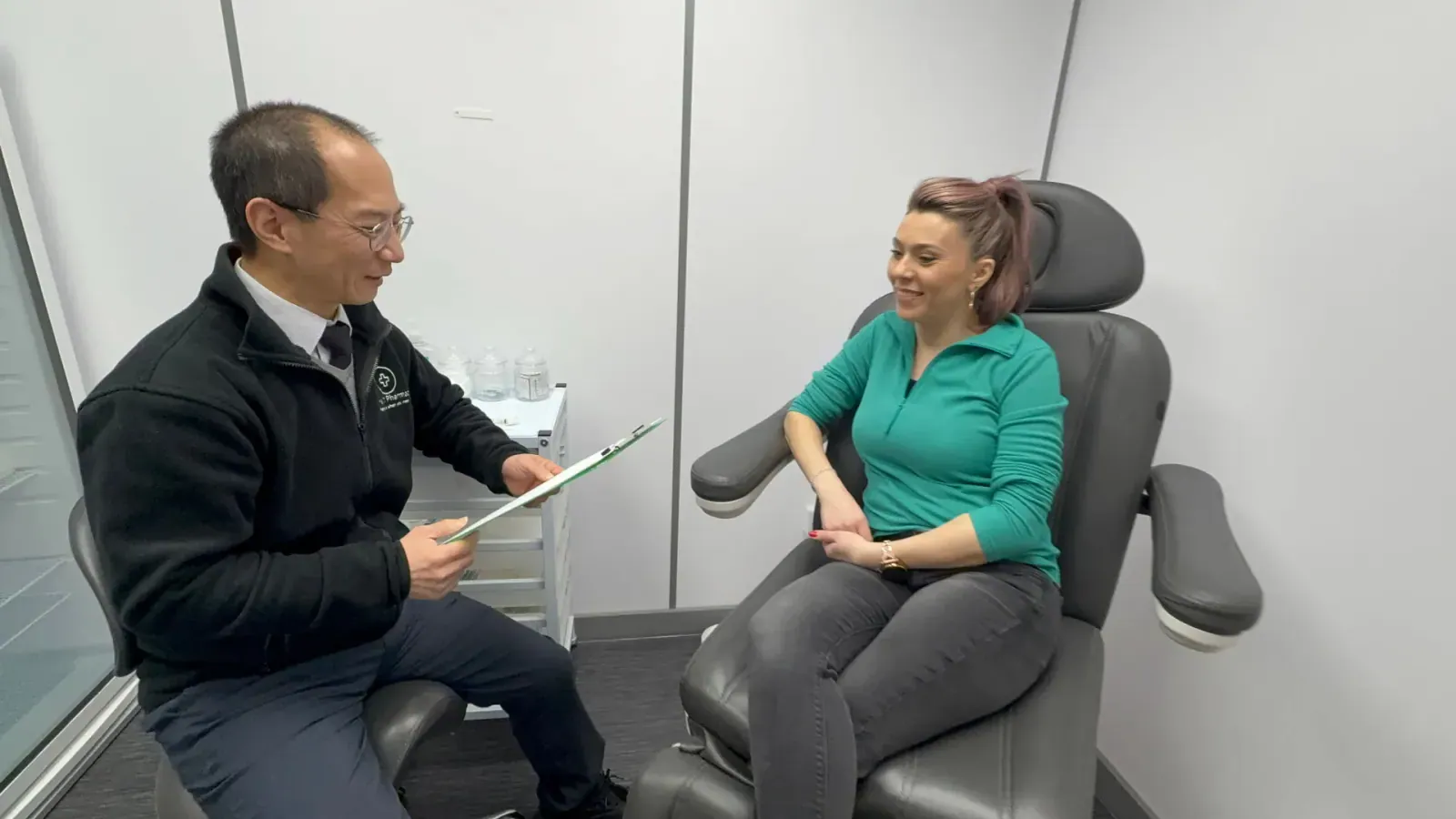 A pharmacist and patient in the private consultation room at Medix Pharmacy